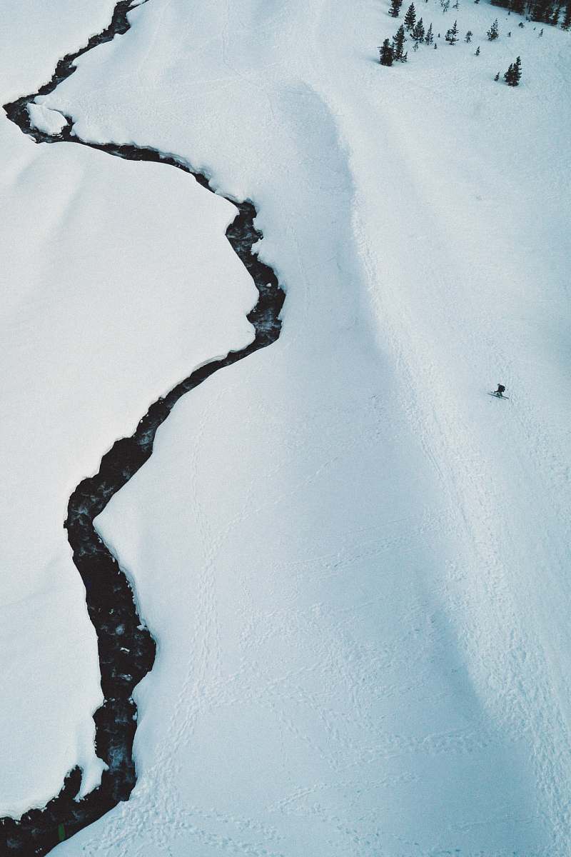 iphone backgrounds man skiing on snowfield during daytime winter